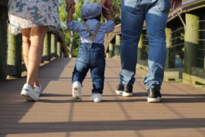 Family walking on a sunny Florida boardwalk