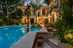 Private villa pool lit up in the evening